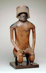 Seated Male with Helmet